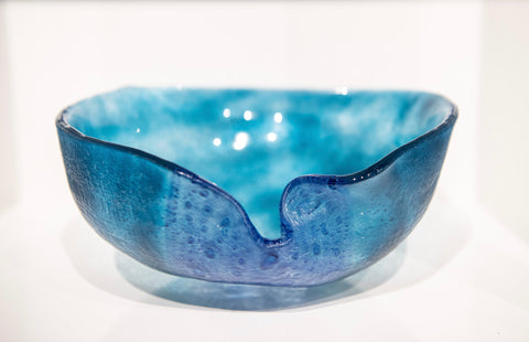 <h4>Turquoise bowl</h4>
Slumped glass.

9in diameter